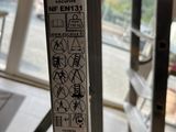 a close up of a sign on a metal pole