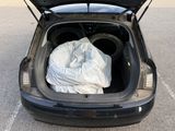 the trunk of a car with a bag in the back of it