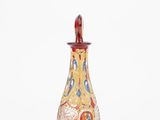 a close up of a glass bottle on a white surface