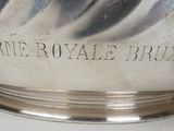 a silver bowl that has writing on it