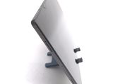 a laptop that is sitting on a stand on a table