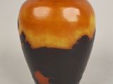 a vase that is sitting on a white surface