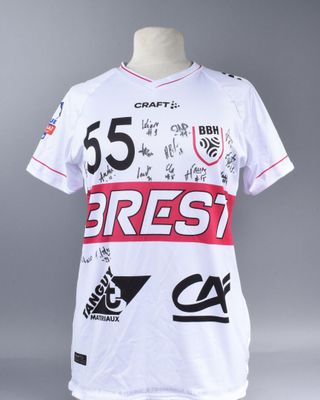 a close up of a white shirt with red and black writing on it