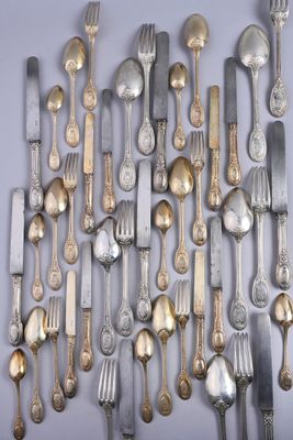 a lot of silver spoons and forks on the table