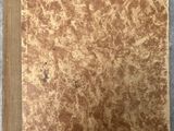 a book with a brown cover sitting on top of a table