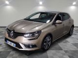 the front of a beige car is parked on a checkered floor