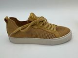 a pair of tan sneakers on a white background