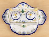 a blue and white plate with a blue and yellow design on it