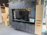 a tv that is sitting on top of a entertainment center