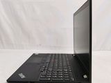 a black laptop with a black keyboard on a white surface
