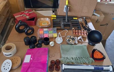 a table with many items on it that include scissors, scissors and other items
