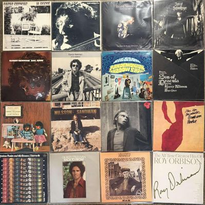 a wall full of various albums and cds