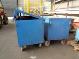 two blue bins sitting next to each other in a warehouse