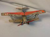 a toy airplane that is sitting on a white surface