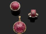 a ruby and diamond pendant and earring suite