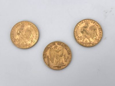 three gold sovereigns, one of which is a sovereign and one of which is a sovereign