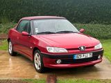 a red car that is parked in the driveway