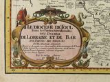 an old map of the world with a picture of a bird on top of it