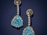 a pair of blue topaze and diamond earrings