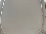 a close up of a toilet seat with the lid up