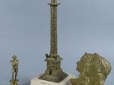 a statue of a man and a bust of a woman next to a statue of a man