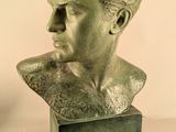 statue of a bust of a man with a beard on a stand