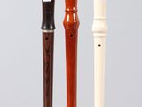 three different types of musical instruments sitting on a table