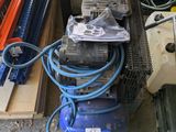 a pile of assorted electrical equipment sitting on the ground