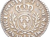 a close up of a coin with a crown on it