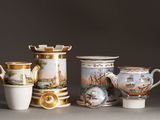 a group of vases that are sitting on a table