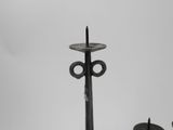 two candles that are sitting on top of a table