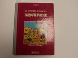 Le livre repose sur une surface blanche et a une couverture rouge.