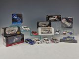 a lot of toy cars on display in a display case