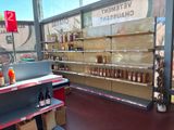 many bottles of wine on the shelves in the store