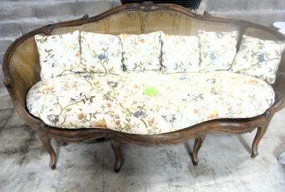 a couch that has a lot of pillows on it