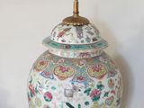 a large vase with a lid sitting on a table