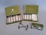 two boxes with a bunch of nails in them