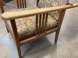 a wooden chair with a floral upholstered seat