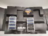four razors in a box on a table