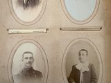four old black and white photos of men in suits and ties