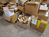 a pile of cardboard boxes and other items on the floor