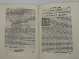 an open book with a black and white image of a man ' s face