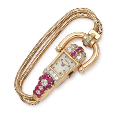 an image of a close up of a wrist watch with a chain