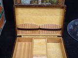 a wooden box with a picture inside of it