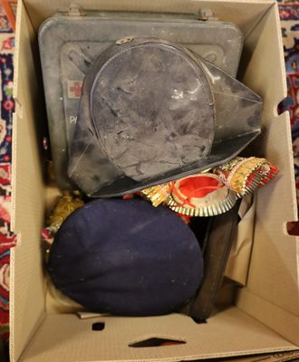 a box with a hat and other items inside of it