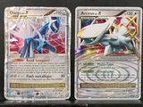 four different types of pokemon cards on display in a display case