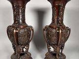 pair of antique bronze vases with handles and handles on stands