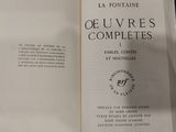 an open book with a black and white image of the title of a novel
