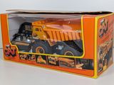 a toy dump truck in the box on the table