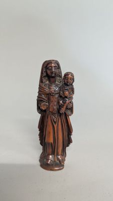 statue of a woman holding a child in her arms